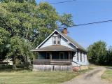 View of front of property with a front lawn and a