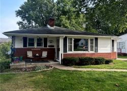 Ranch-style house with a front lawn