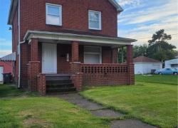 View of front of property with a front yard and a